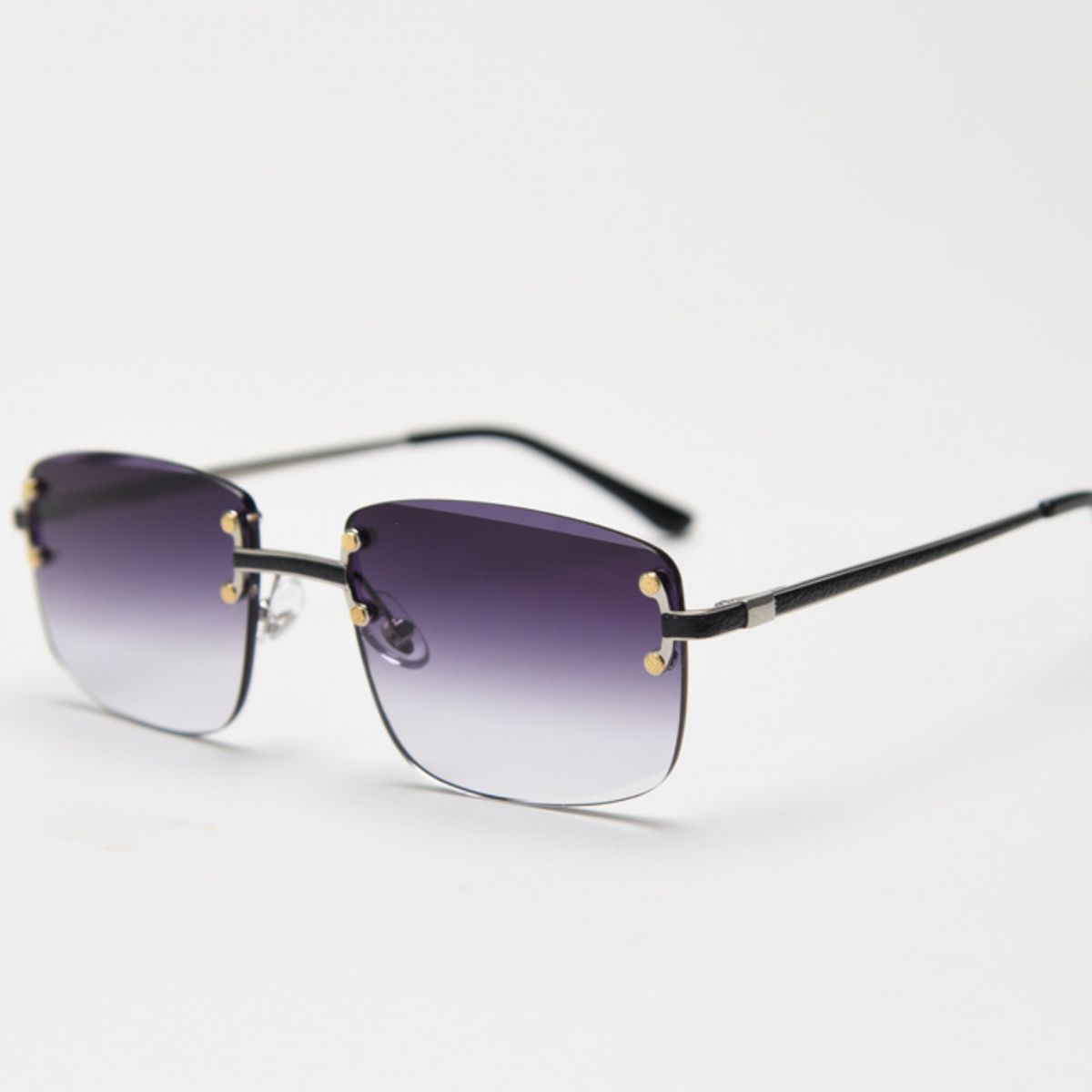 Side profile of lightweight metal frame rimless sunglasses showing slim temples