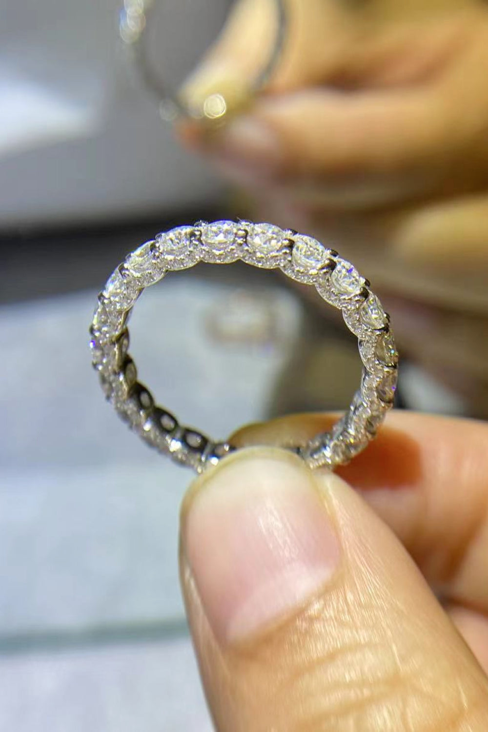 Detail shot of 1.5 carat moissanite sparkle and smooth polished band