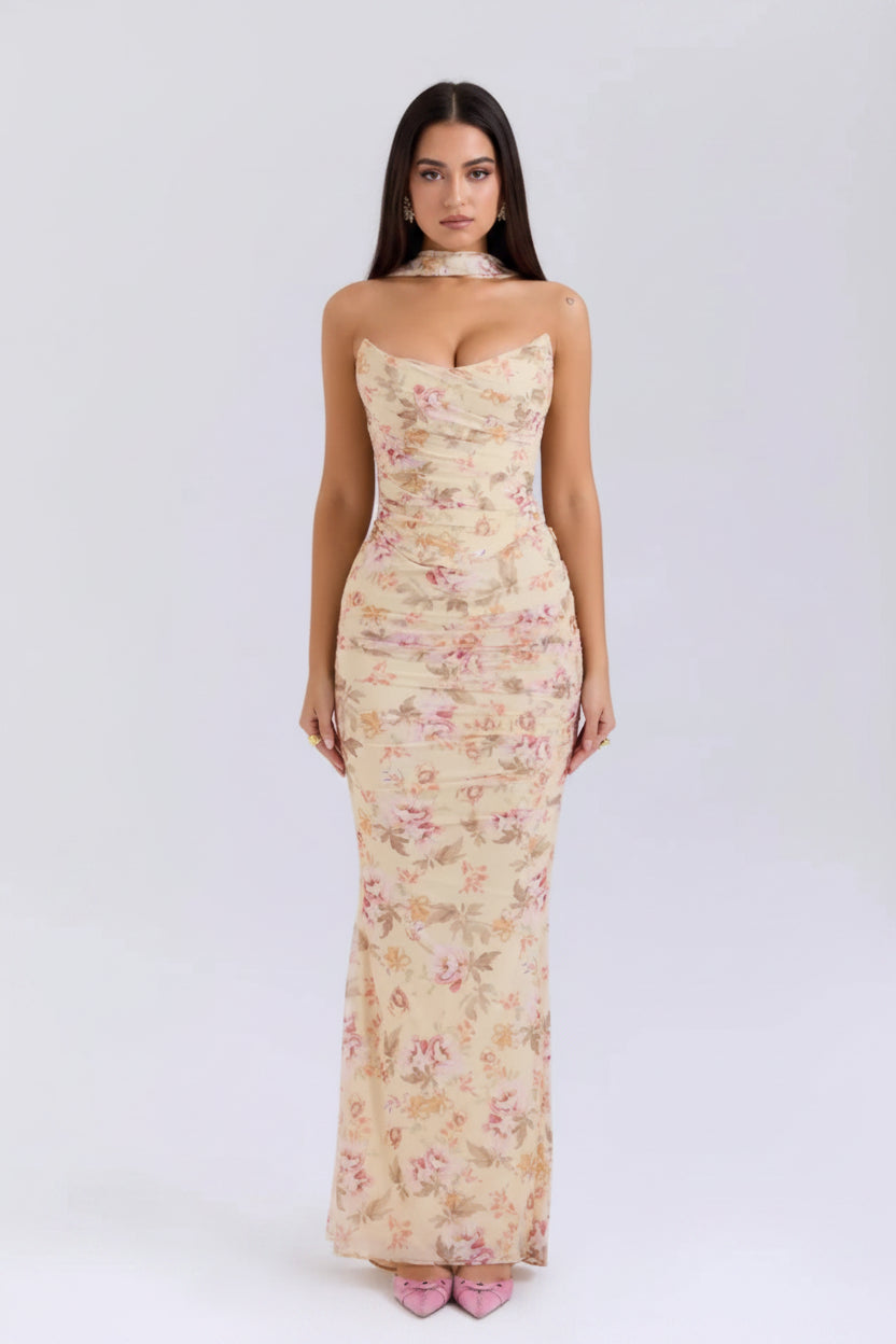 Woman wearing a floral strapless dress on a white background