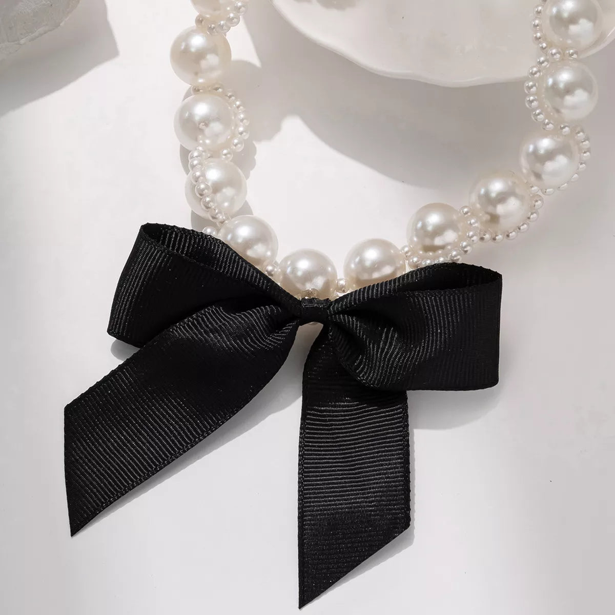 Black Bowtie Choker Necklace With Pearls - Top View White Background - Rebellious Gal Jewelry