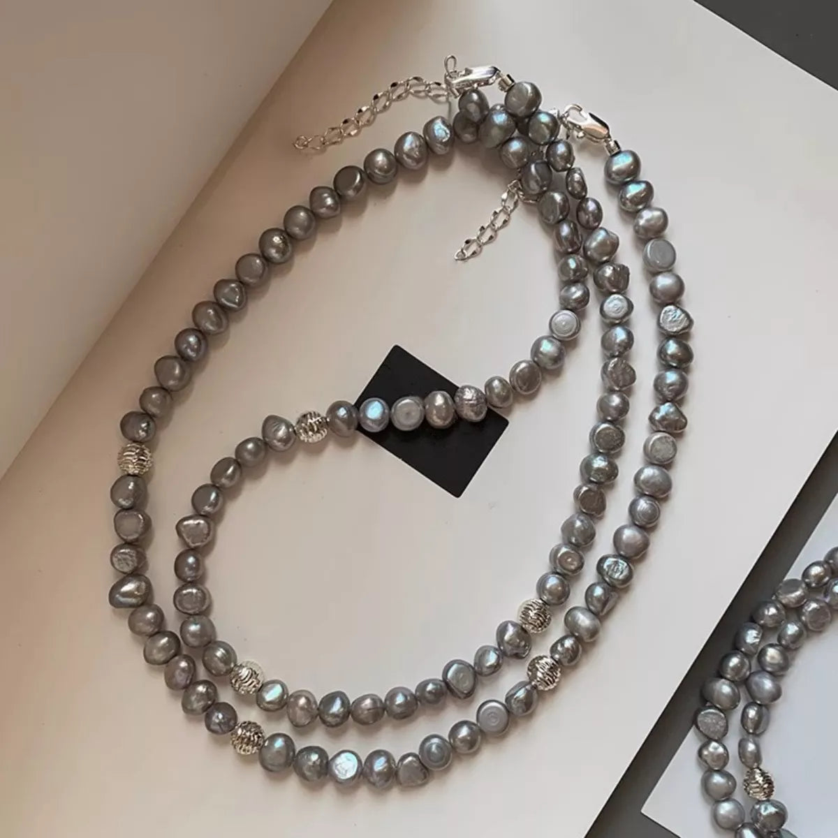 Pearl necklace on a light surface