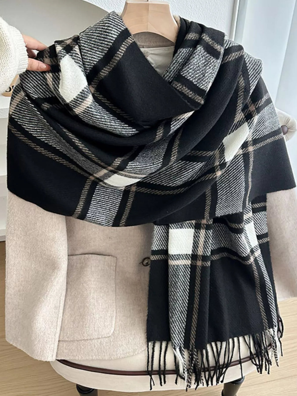 Close-up of classic plaid pattern and soft polyester fabric on winter scarf