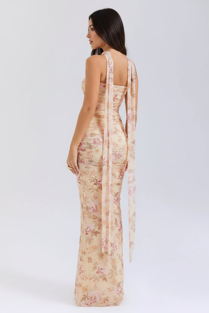 Floral dress with a sheer overlay on a white background