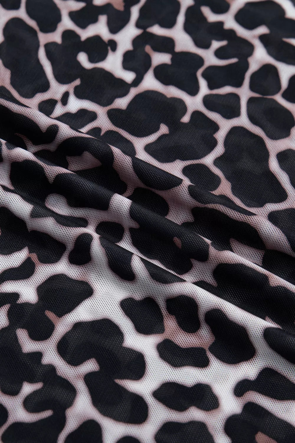 Close-up of fabric with black and white abstract pattern
