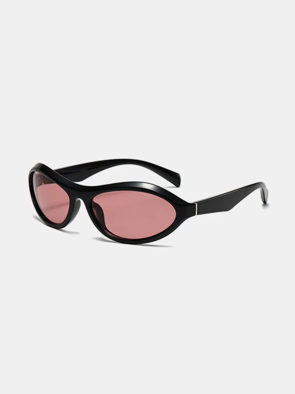 Sunglasses styled low on nose showing cat eye shape and lens reflection