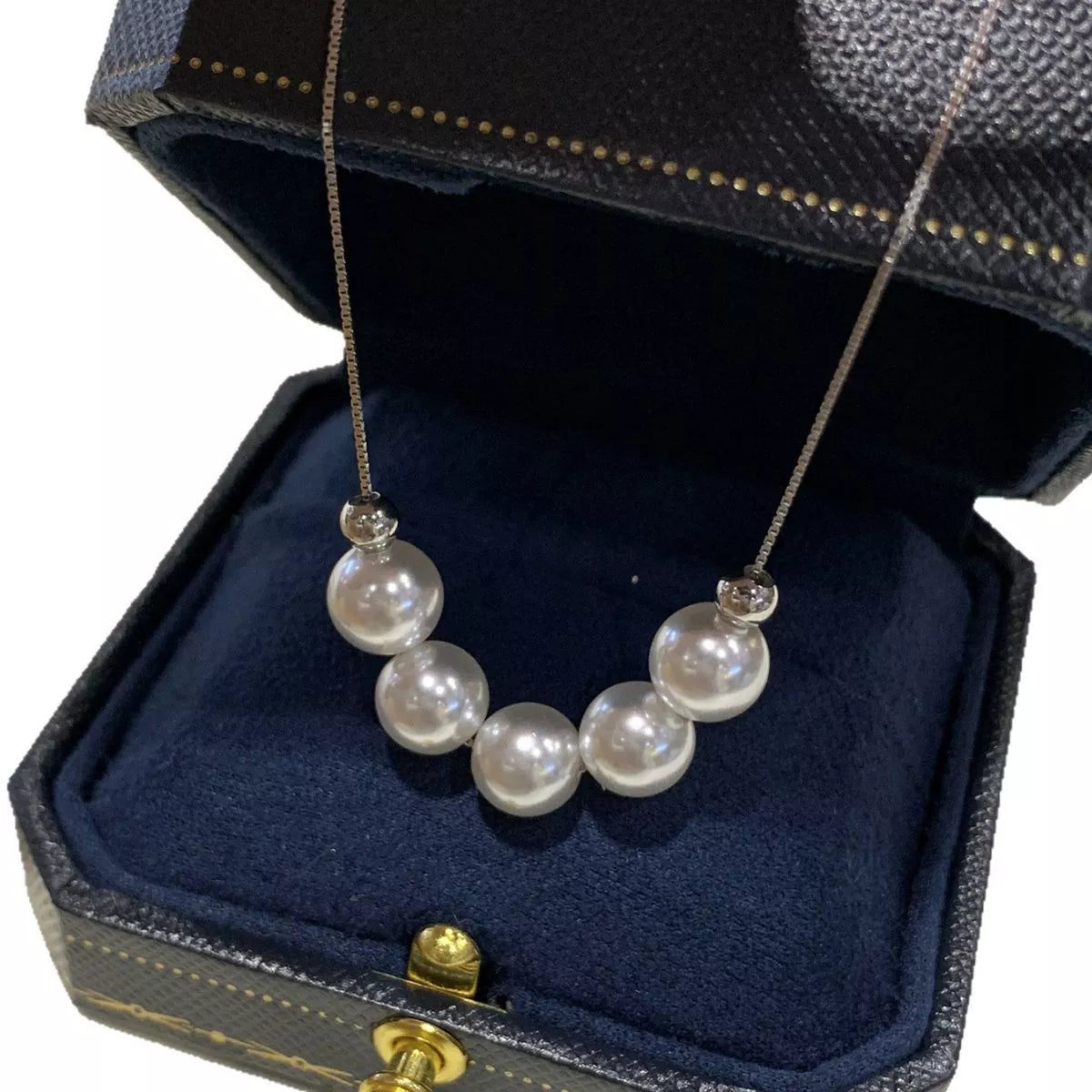 Pearl necklace in a jewelry box