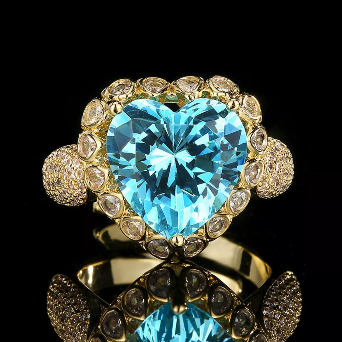 Rebellious Gal heart shaped ring 18K gold plated zircon accents on black background