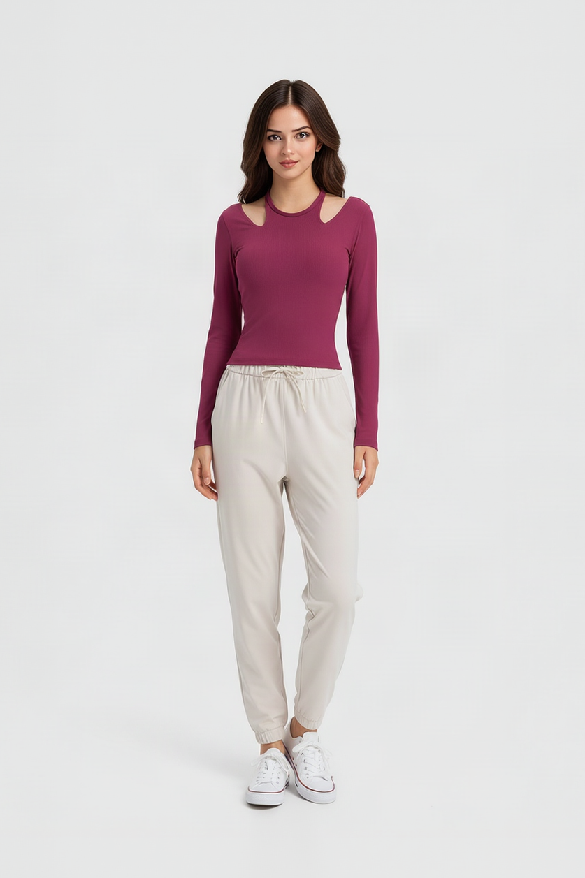 Berry ribbed long sleeve top with shoulder cutouts, cream drawstring joggers, white sneakers