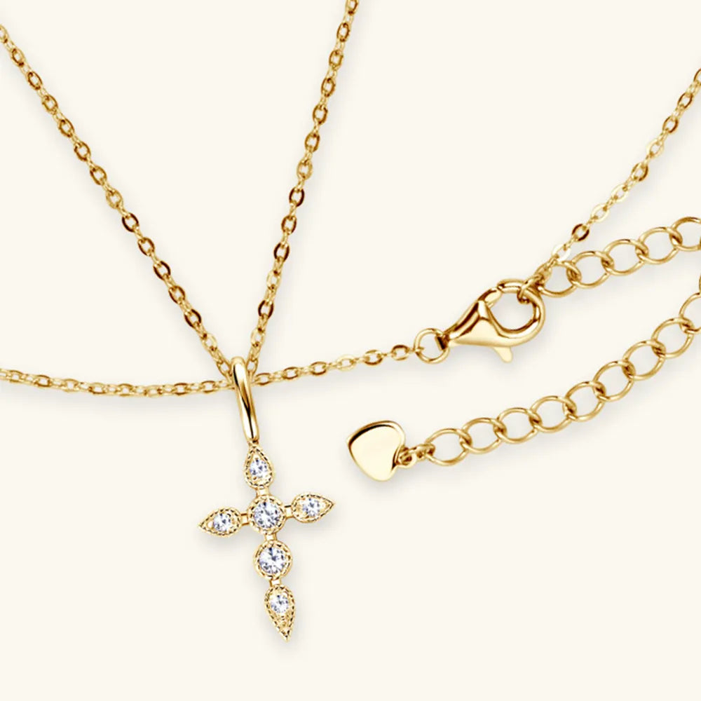 Model wearing Rebellious Gal moissanite cross pendant with rebellious layered look