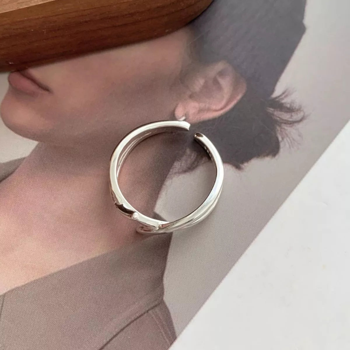 Side profile of adjustable open ring showing 0.6" width and clean lines