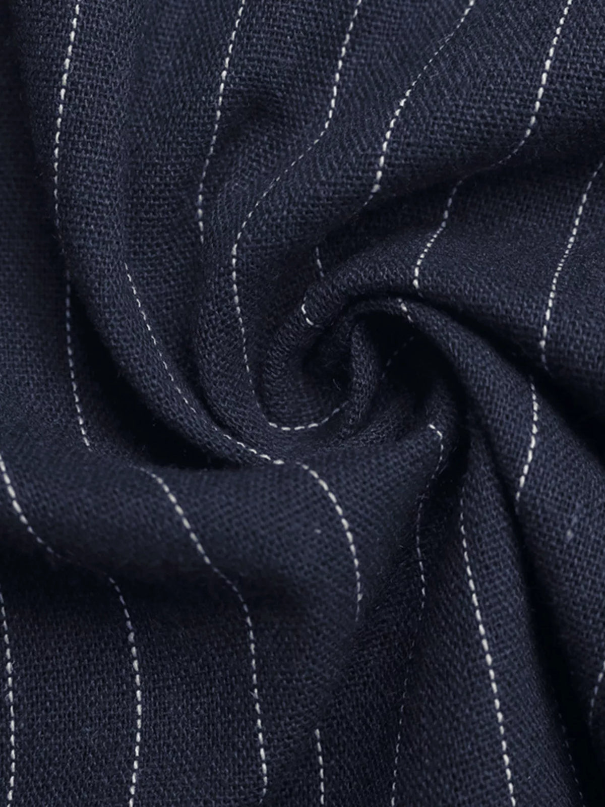 Close-up of navy pinstripe fabric with white lines