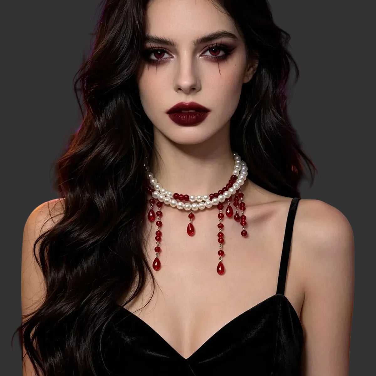 Pearl choker with red beaded drips worn with a black strappy top