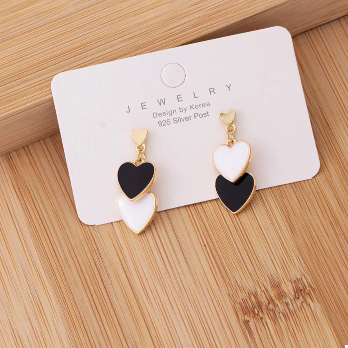 Side view gold plated double heart earrings women trend dangling sway 2026