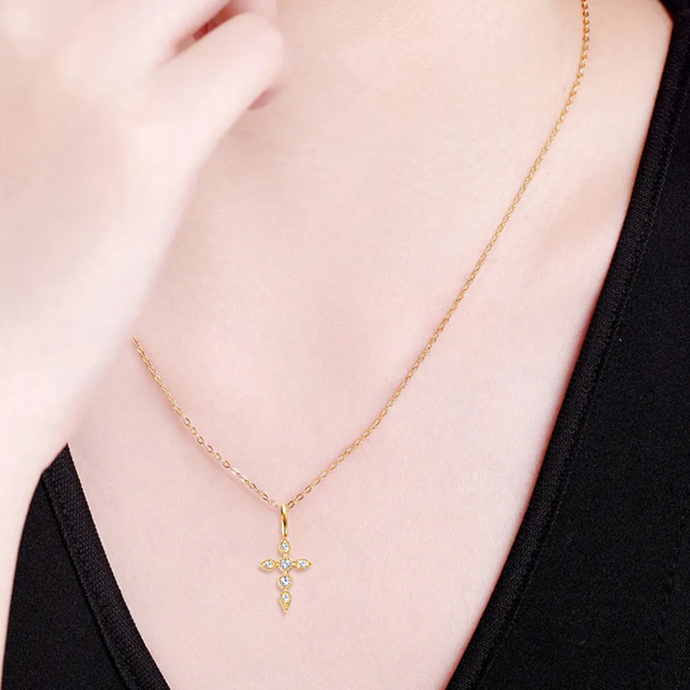 Lifestyle image: Rebellious Gal moissanite cross necklace styled with edgy outfit