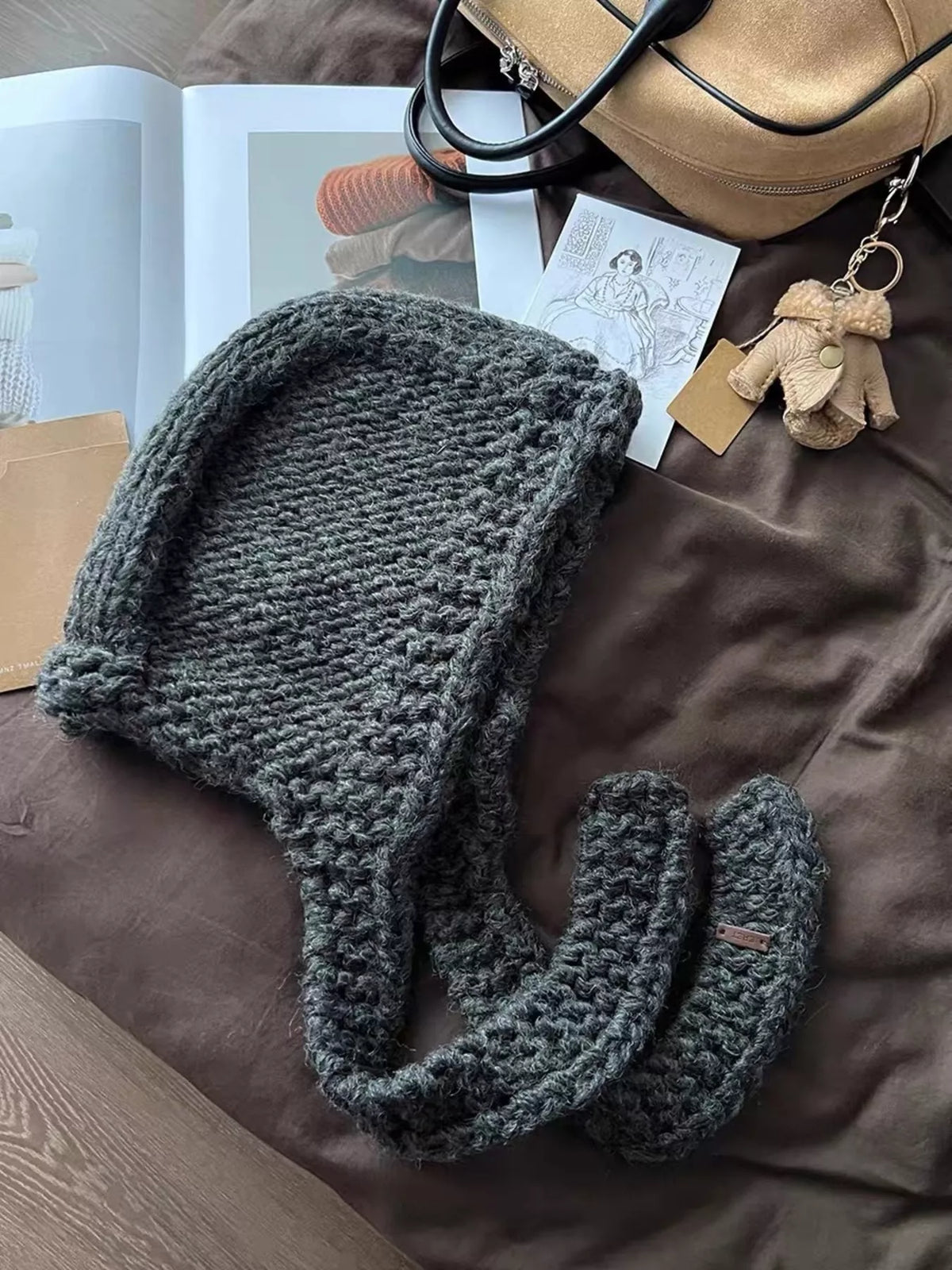 Side view cozy knitted hooded scarf hat women trend warm winter accessory 2026