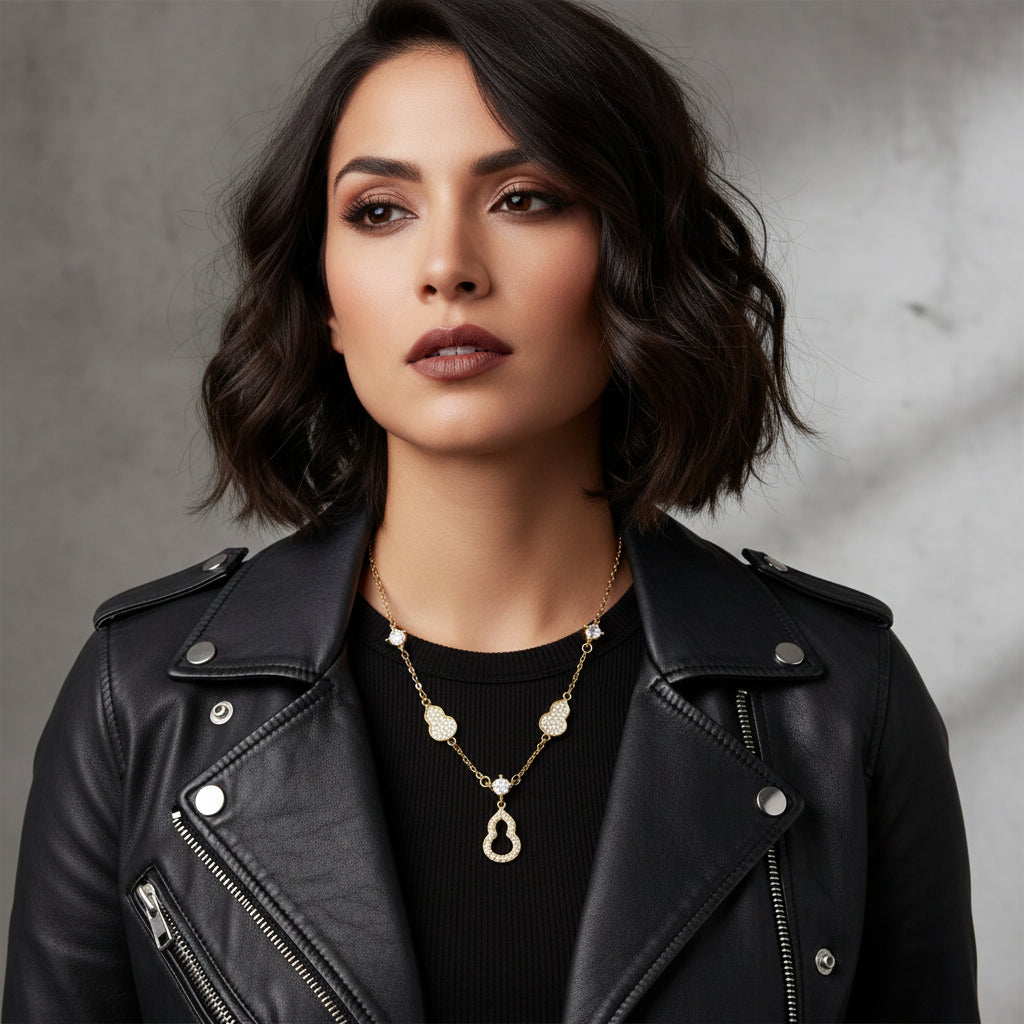 Gold necklace with heart-shaped links on a white background