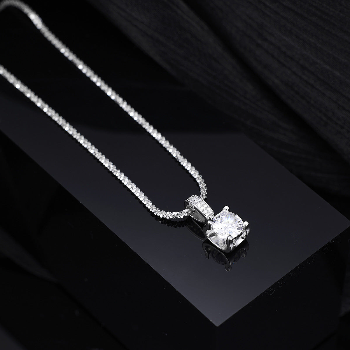 Side profile of zircon pendant necklace showing 15.7" chain and 2" extension
