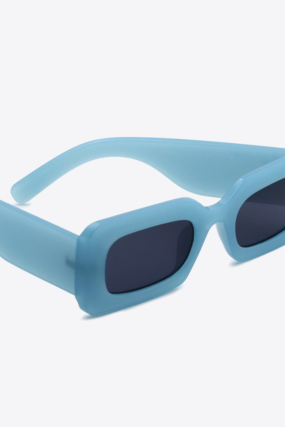 Modern rectangular sunglasses styled with outfit