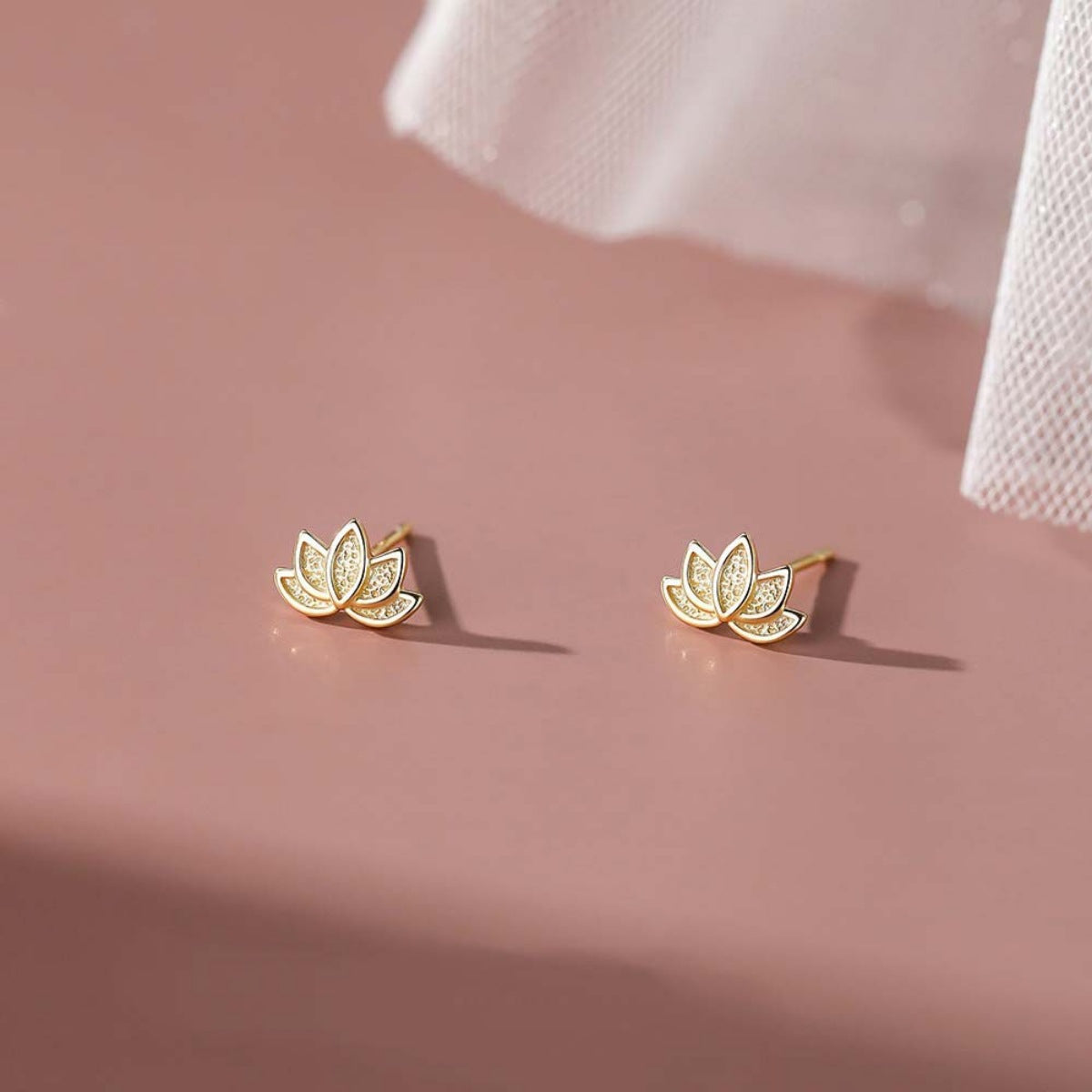 Side view of Lotus Flower Stud Earrings showing thickness