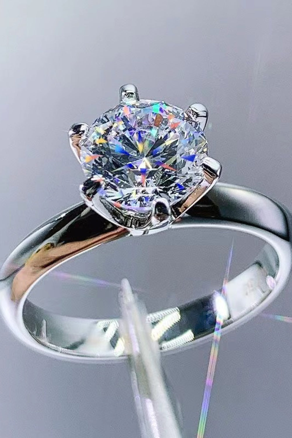Close-up 6-prong setting on 3CT moissanite ring showing brilliant sparkle and fire