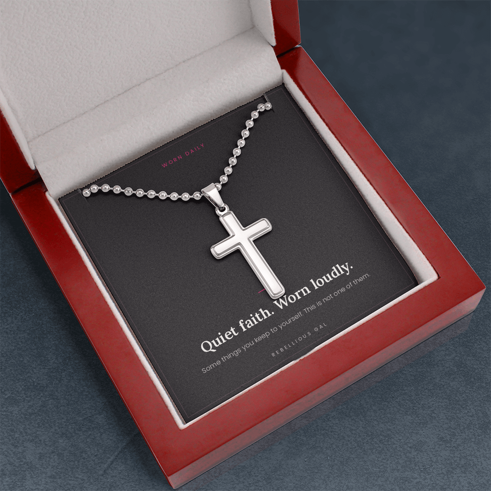 Mahogany gift box angled on slate gray, steel cross necklace on its black card
