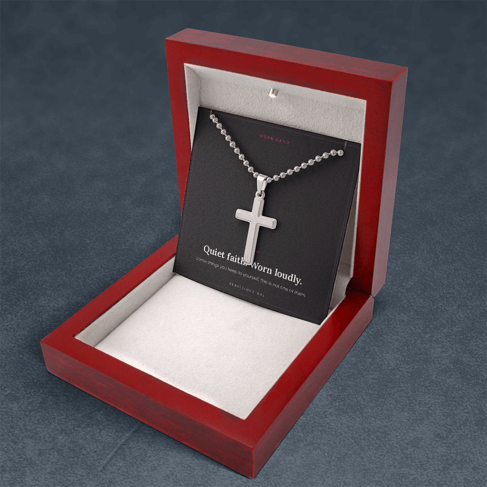 Upright mahogany box standing open, steel cross necklace draped on the message card