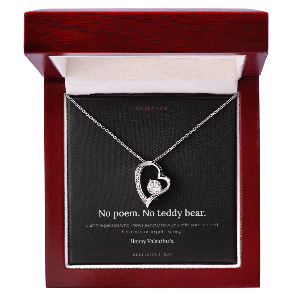 White gold heart pendant on the No Poem Valentine's card in an open mahogany box