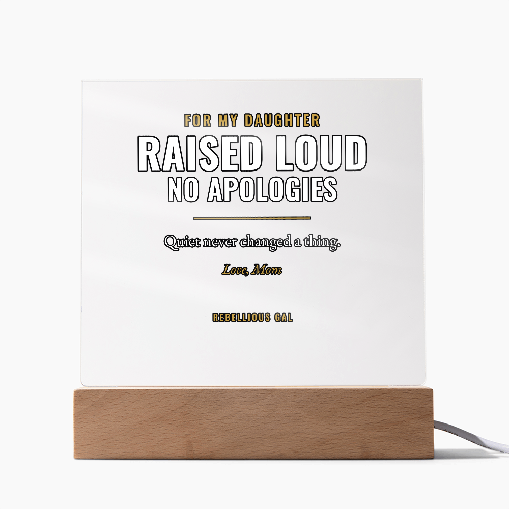 Studio-white backdrop, unlit panel on a honey wood block, cord curling right