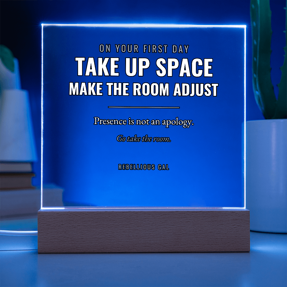 Whole panel glowing deep blue, white lettering sharp against the darkened room behind