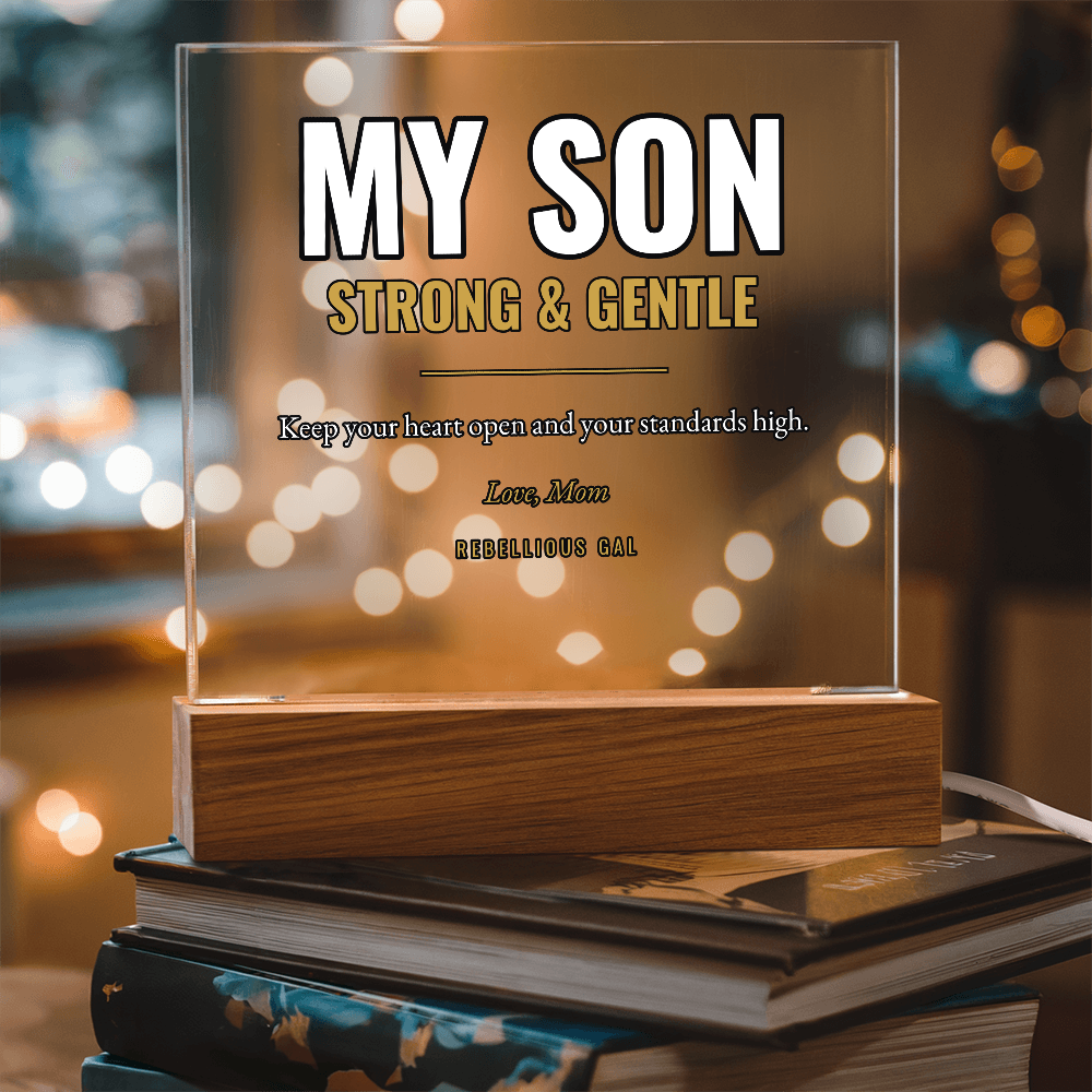 My Son Strong and Gentle in white and gold, pale cord trailing from the base