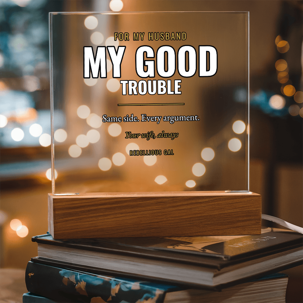 My Good Trouble lettered on the upright acrylic, honey block and hardback stack below