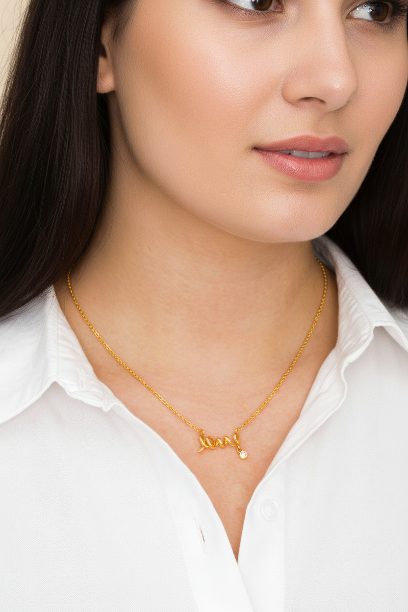 Woman wearing a gold necklace with a pendant on a white background