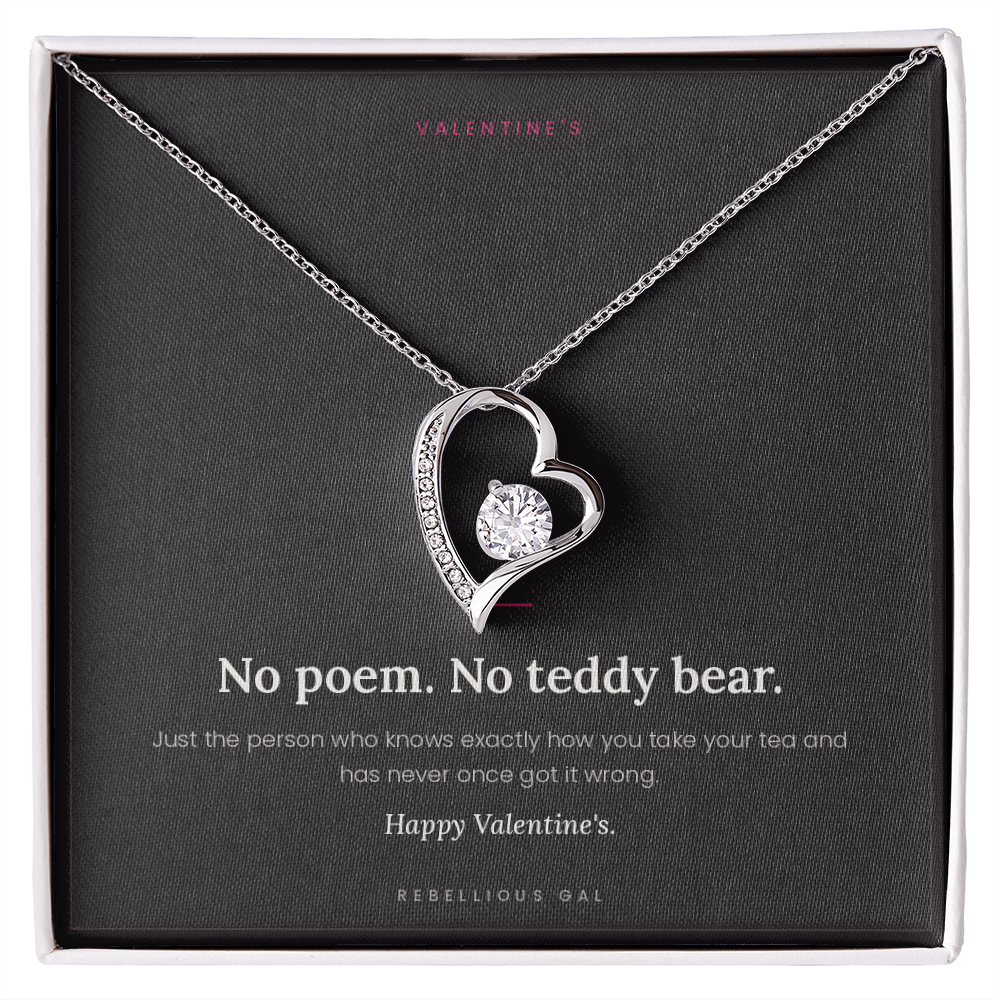 aSilver heart pendant necklace in a gift box on the No Poem Valentine's message card