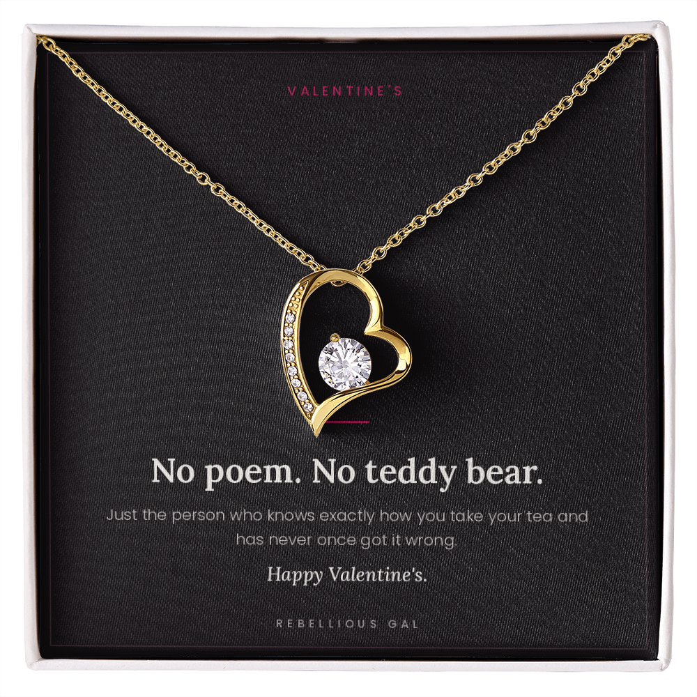 aGold heart pendant necklace in a gift box on the No Poem Valentine's message card
