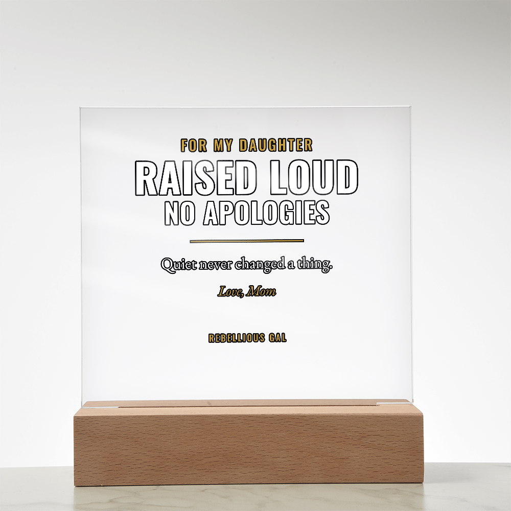 Warm beech stand holds the printed acrylic panel square-on above pale veined marble