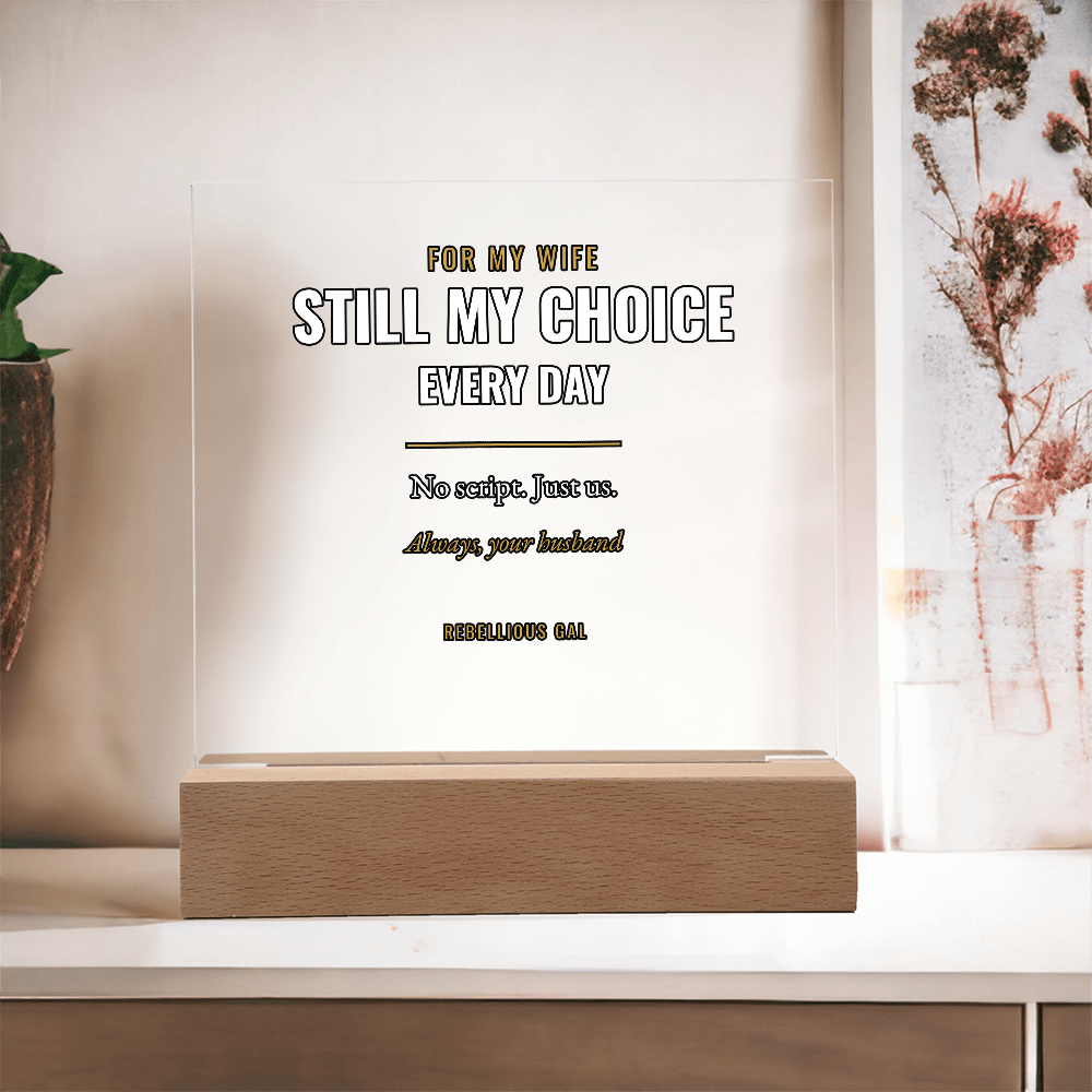 Terracotta planter left, framed coral blooms right, the beech base squared on a white ledge
