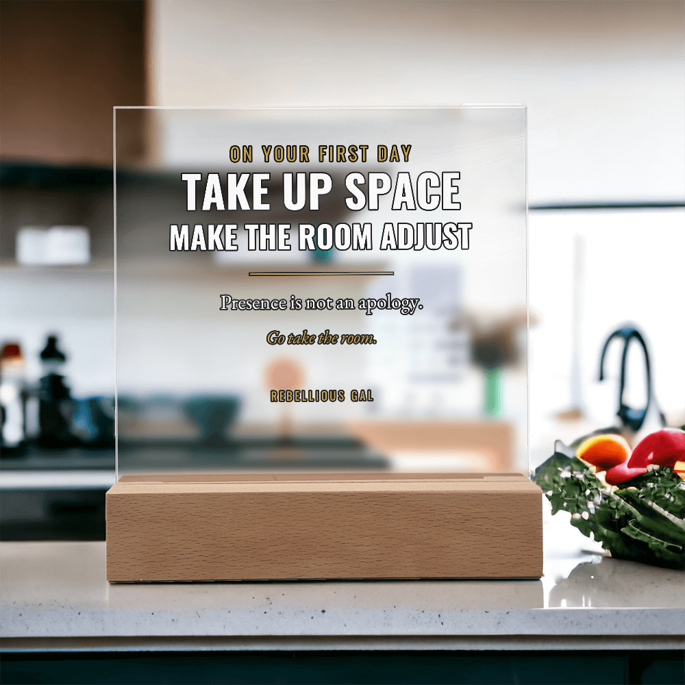 Blurred kitchen behind, dark greens and a glossy red pepper heaped on speckled stone