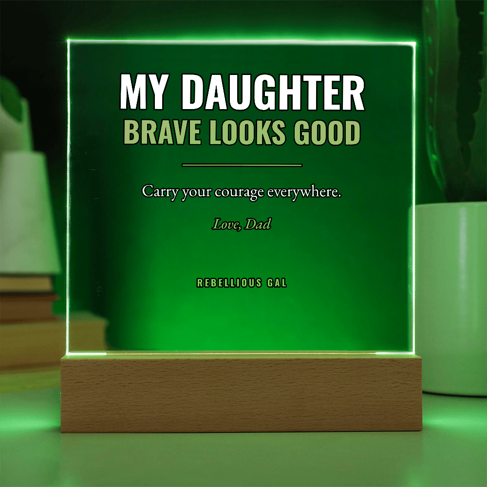 Flooded vivid green, the opaque panel lights its beech base and a nearby book stack