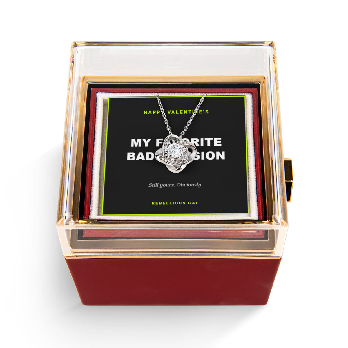Open red box on white, silver love knot pendant over a My Favorite Bad Decision card