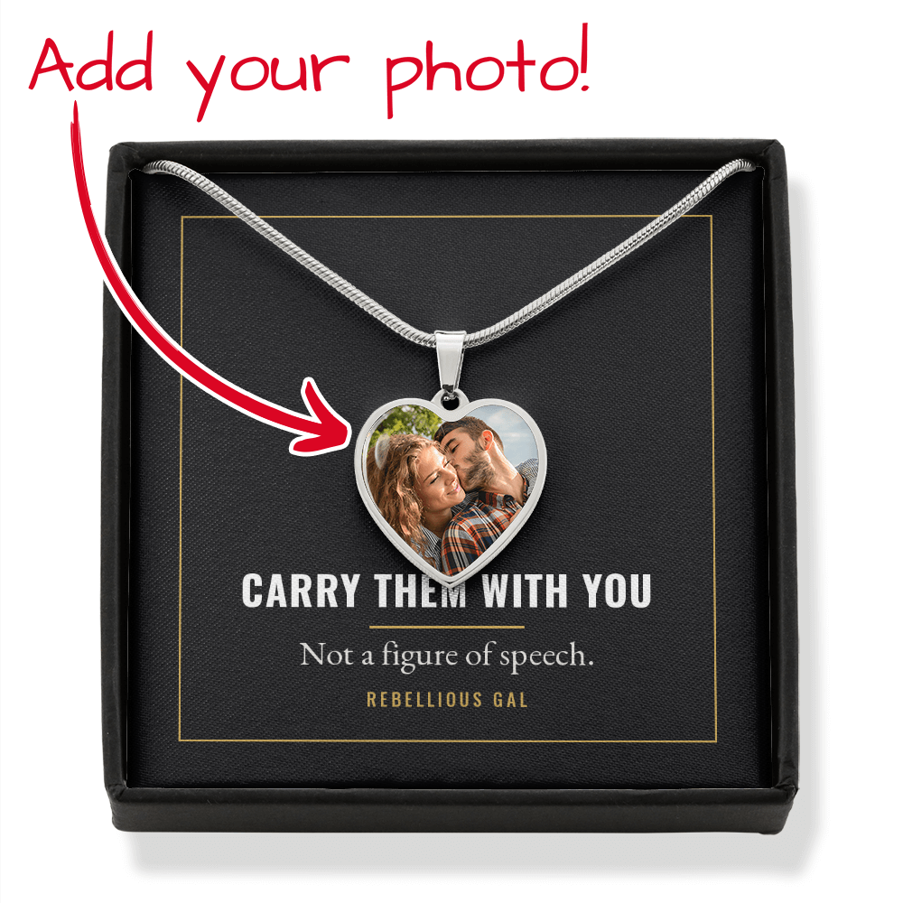 Handwritten overlay and red arrow mark the silver photo heart inside its black box