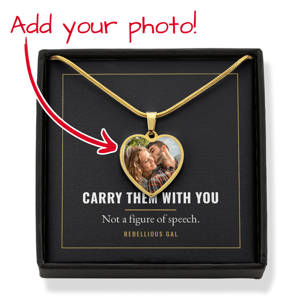 Red handwritten note and curving arrow point at the gold photo heart in its box