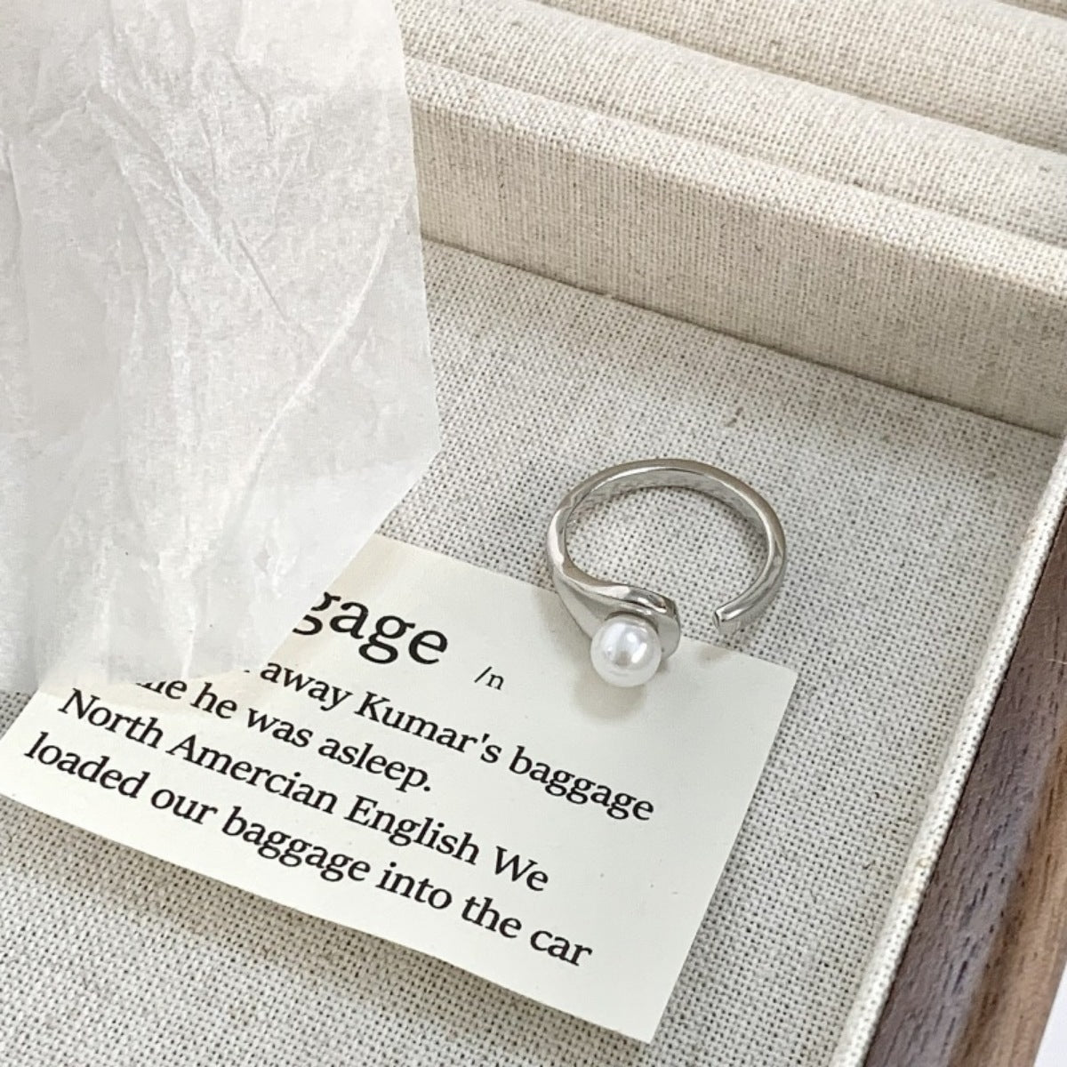 Side profile of adjustable pearl cuff ring showing 0.7" width and open design