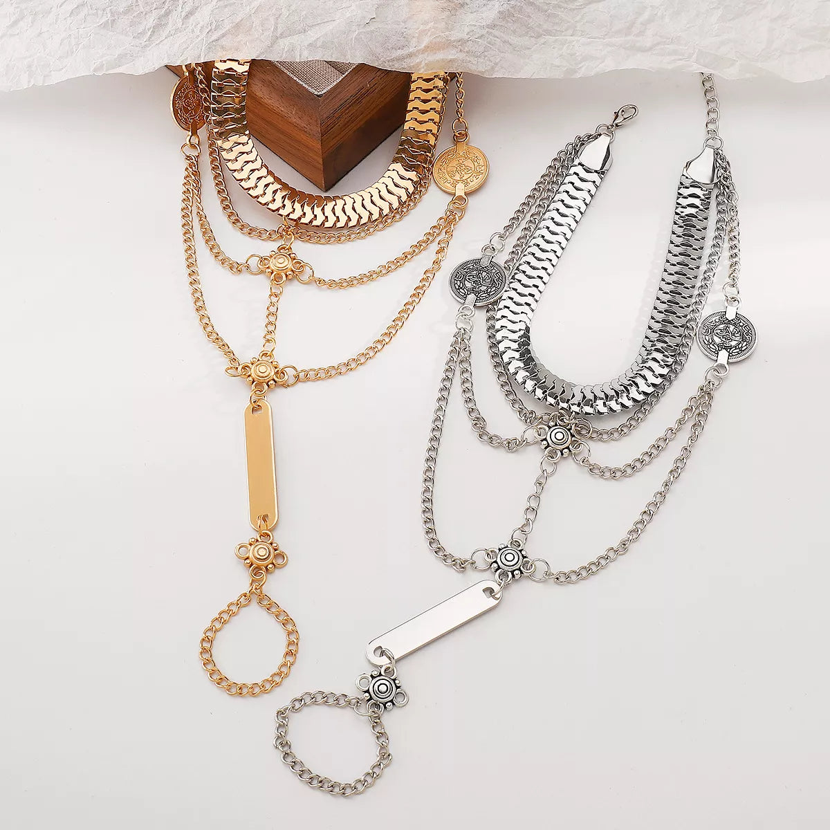 Multi layered chain bracelet finger ring styled with rings and nails rebellious vibe