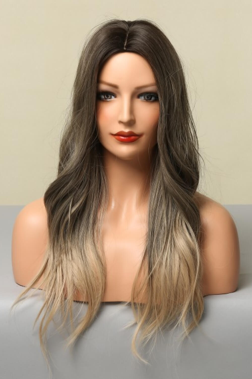 Detail shot of glossy synthetic hair texture on Rebellious Gal straight wig on mannequin