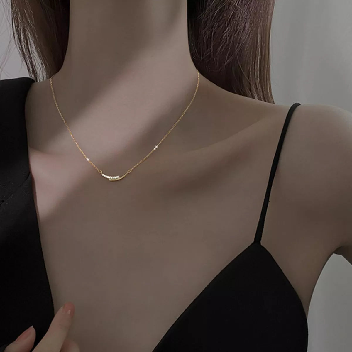 Rhinestone pendant necklace in 925 sterling silver on model's neck close-up