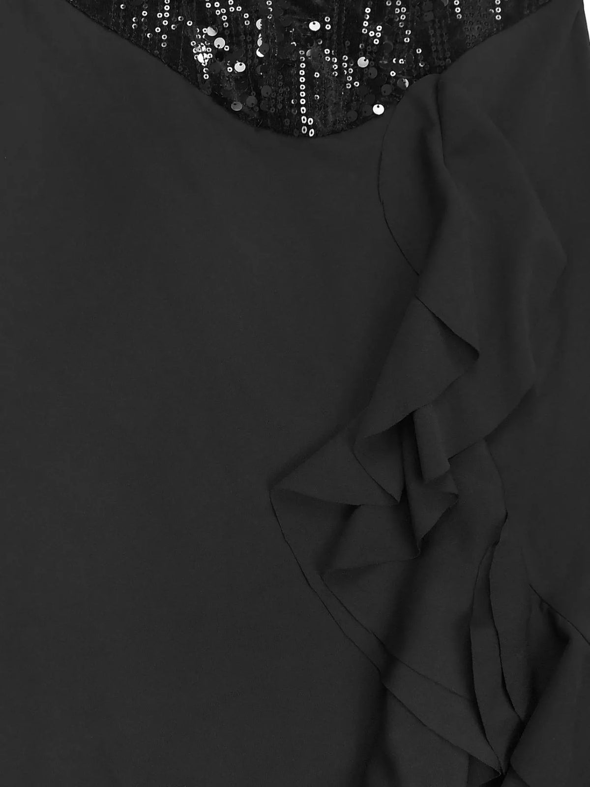Black dress with ruffled details and sequined top on a plain background