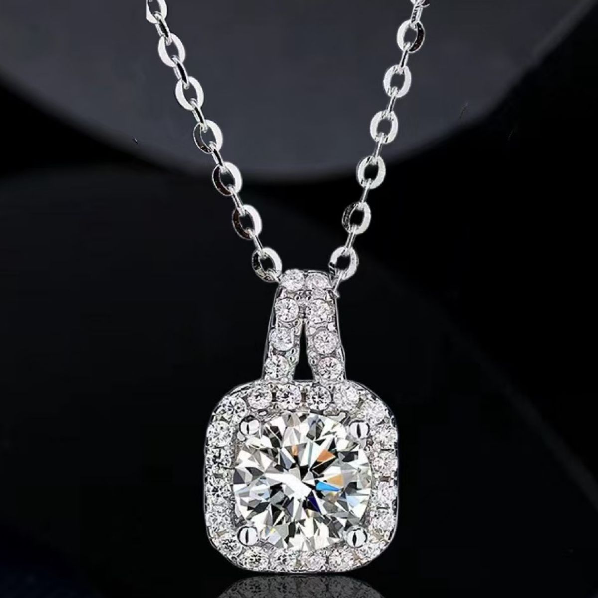 Close-up texture of 925 sterling silver chain and secure moissanite bail