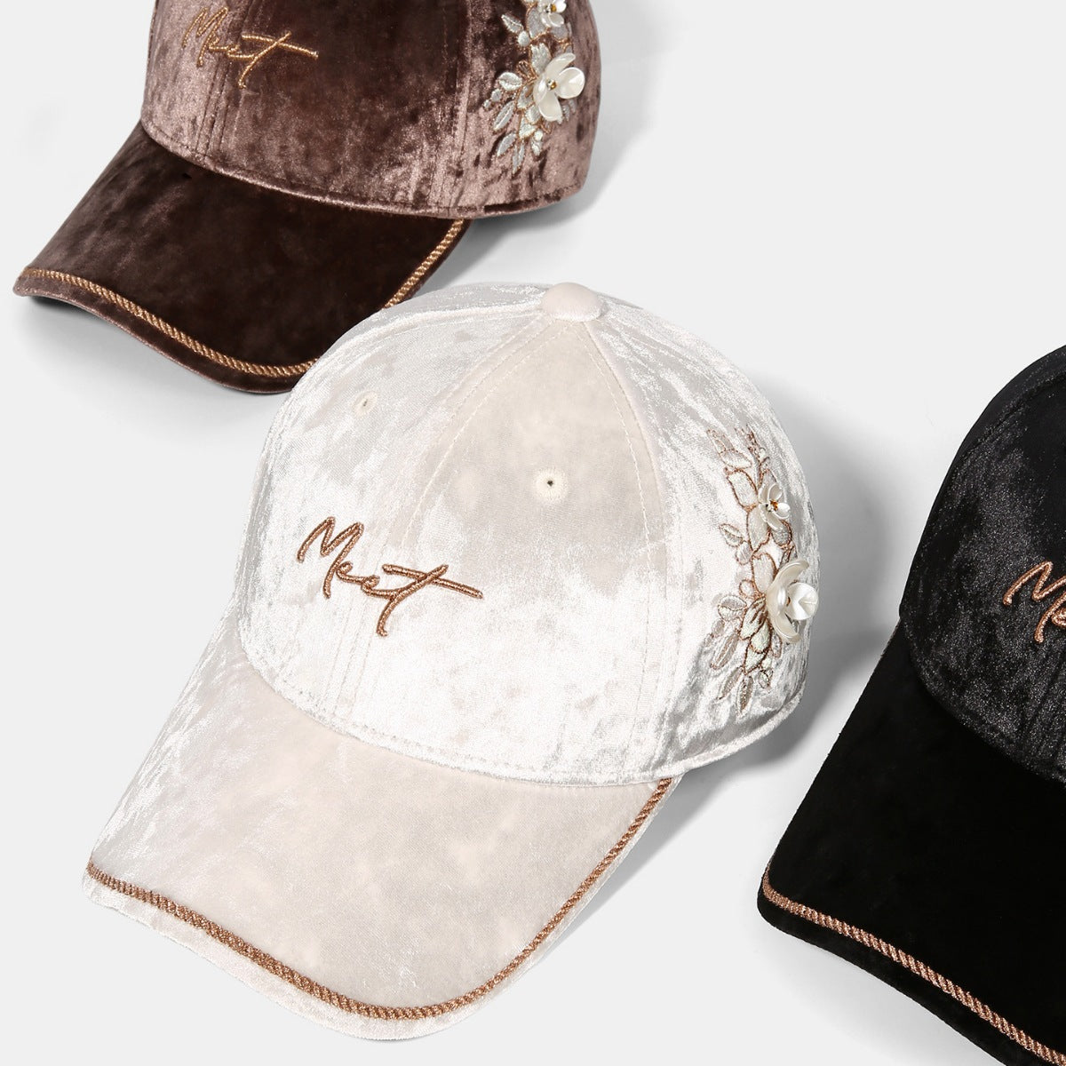 Top view of Rebellious Gal velvet baseball cap with adjustable strap and floral accent