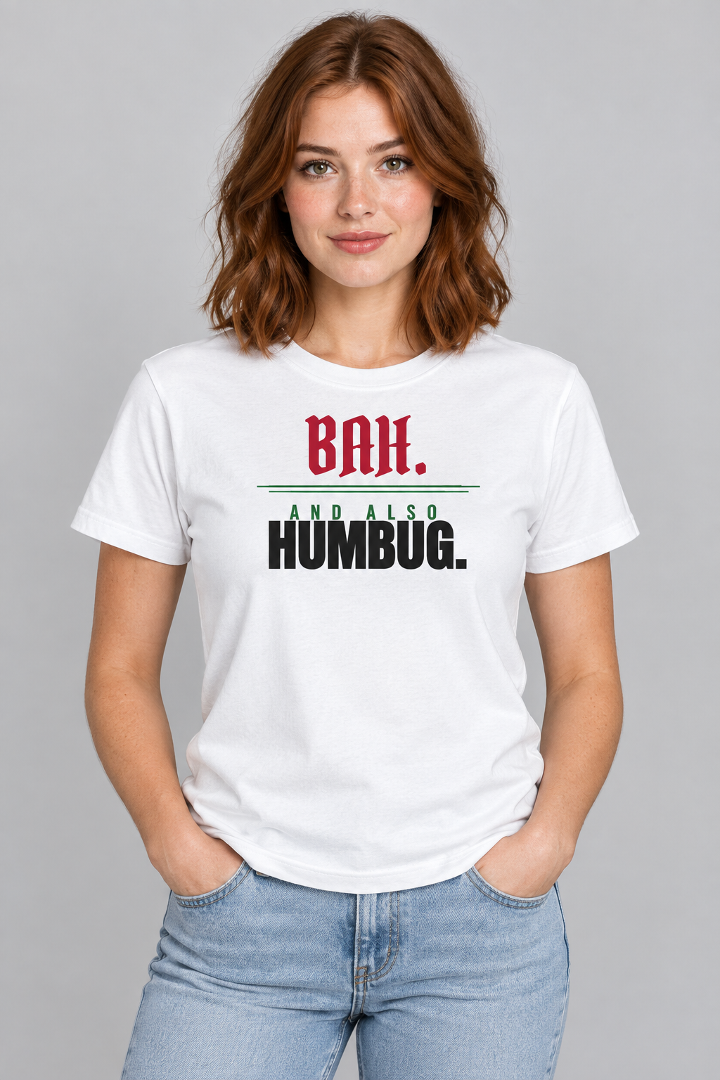 Woman with auburn hair in the white Bah and Also Humbug tee, studio backdrop