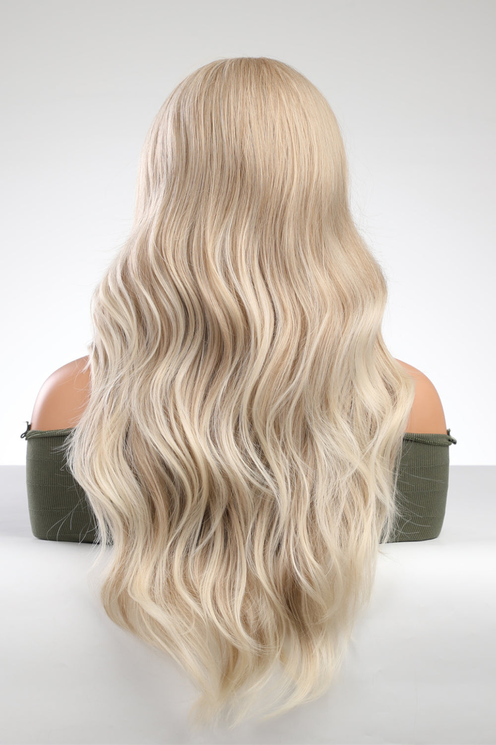 Back view of 25 inch long wave synthetic wig on studio mannequin